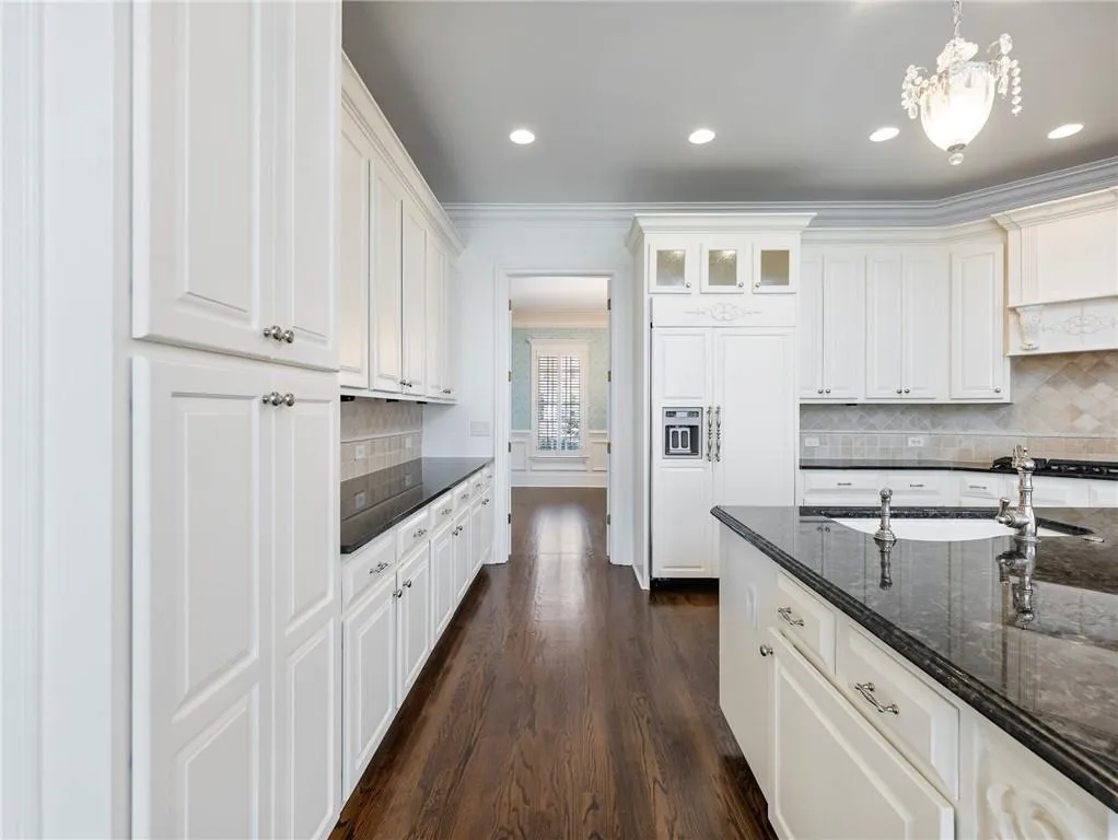 Pantry to the left and leading to the dining room beyond the kitchen.