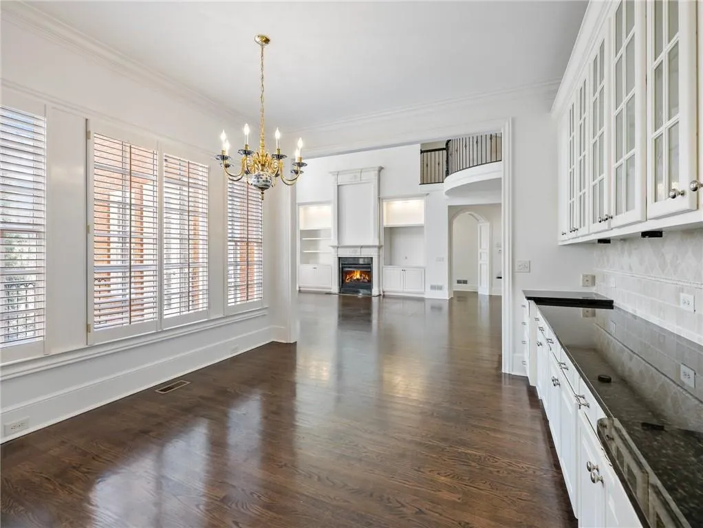View of breakfast room with great room beyond.