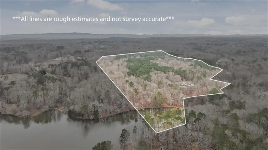Aerial view of property and Garrison Lake