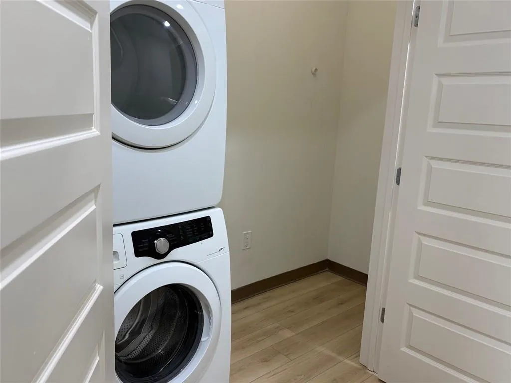 stacked  full size washer and dryer with extra storage
