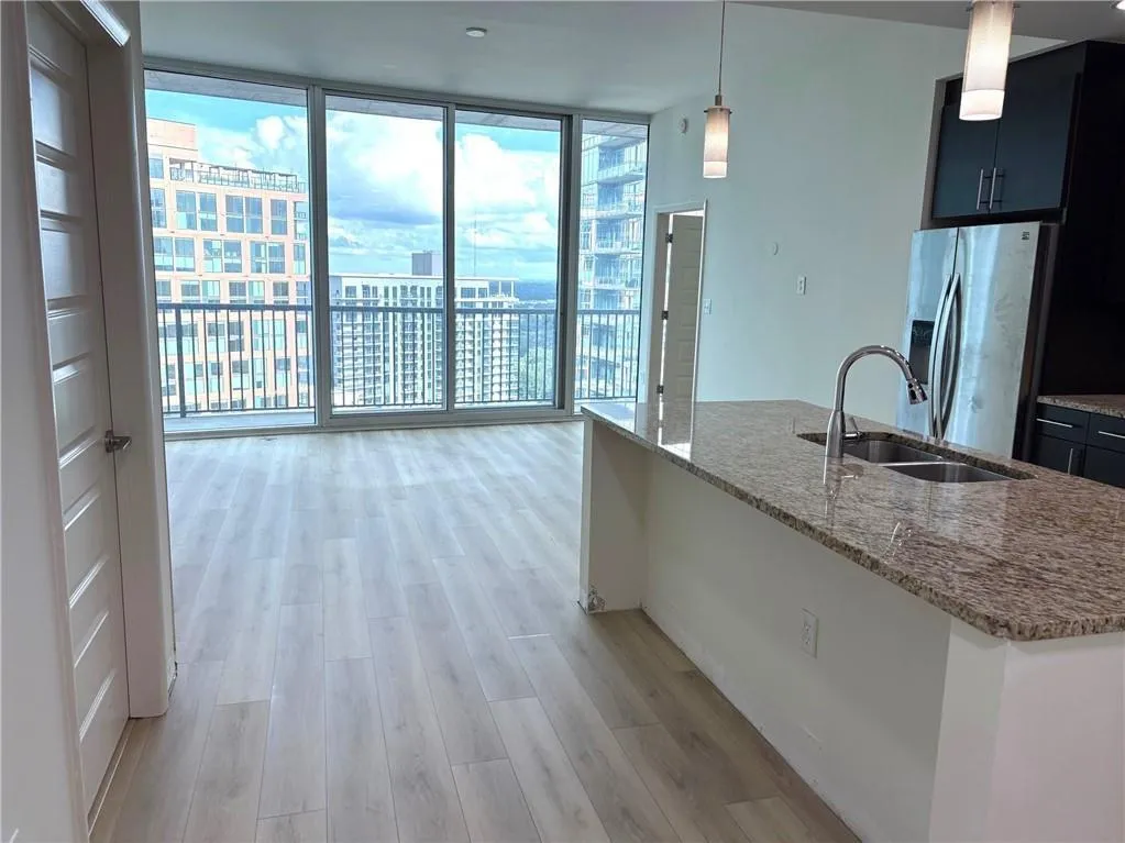 open concept kitchen over looks living area