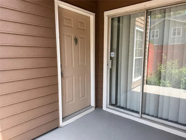 Panel door with decorative knocker