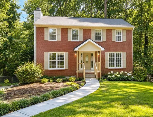 Red brick exterior with white trim
