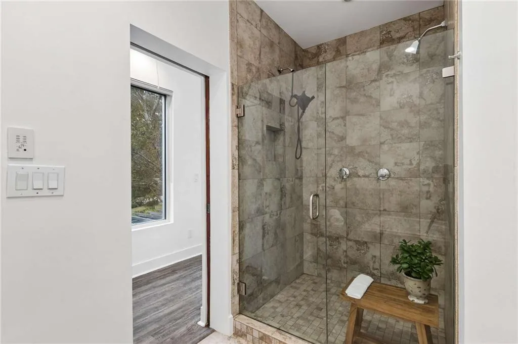 primary bathroom shower and full jetted tub