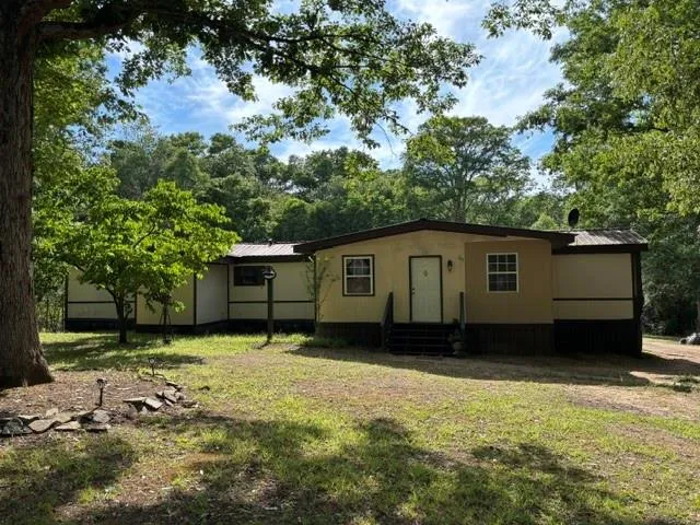 Expansive natural surroundings with mature trees