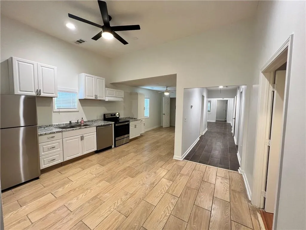Checkout the space of the kitchen & hallway to the front of the home.