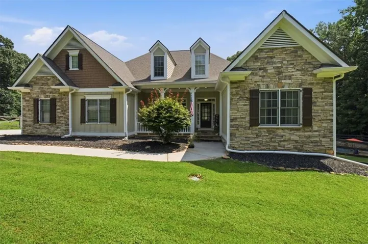 Stone and siding exterior with gabled roof lines