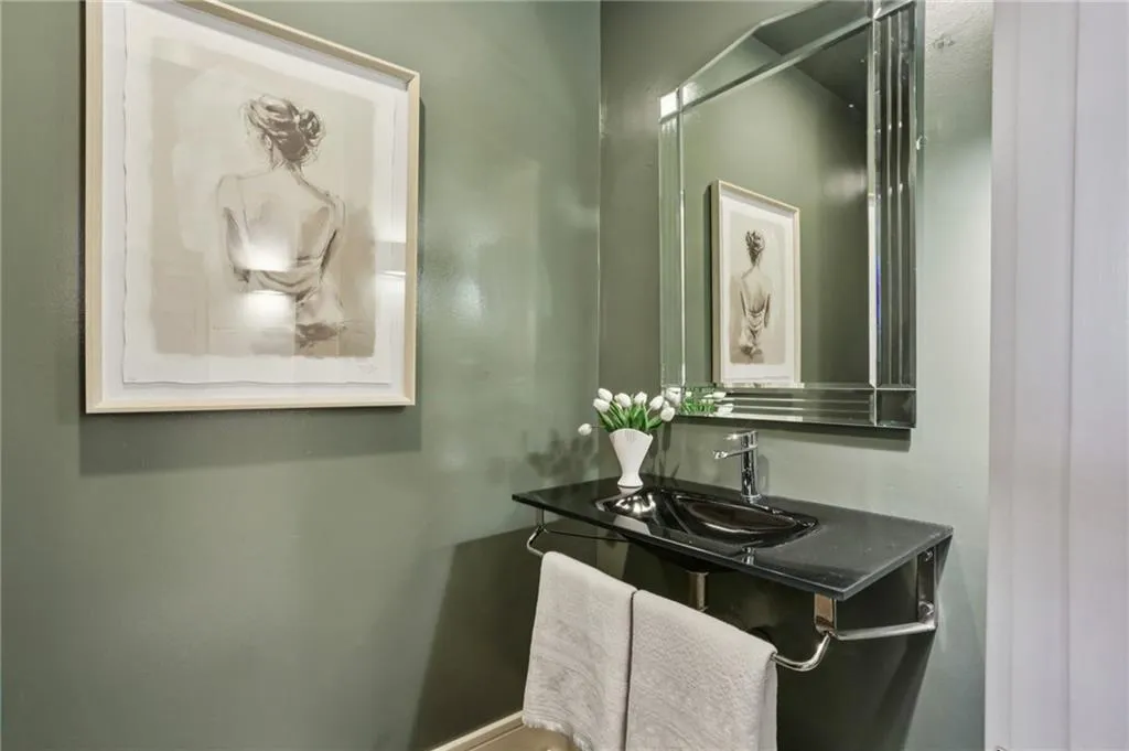 Elegant half bath off the gallery hallway