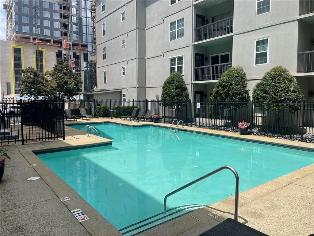 Community pool with a patio area