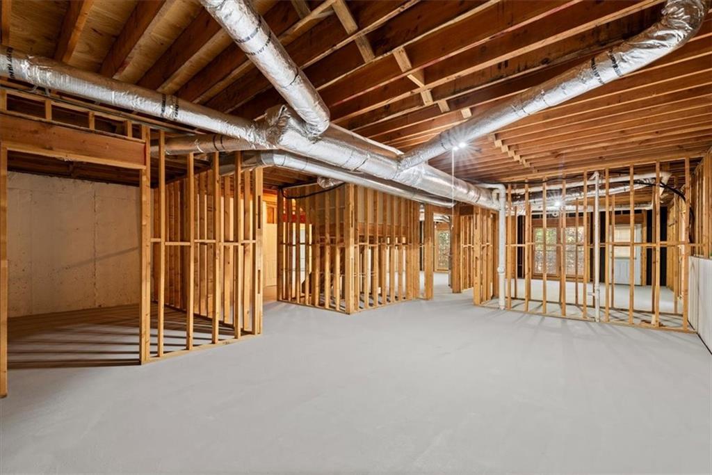 Discover the untapped possibilities of the unfinished daylight basement, featuring a bathroom that has been plumbed for convenience. This blank canvas awaits your creative touch, offering endless potential to transform the space into your dream retreat. Whether you envision a cozy entertainment area, a home gym, additional bedrooms, additional living space or all of the above, the unfinished basement provides a versatile foundation to bring your vision to life. Embrace the opportunity to customize and create a space that perfectly suits your needs and lifestyle. Discover the untapped possibilities of the unfinished daylight basement, featuring a bathroom that has been plumbed for convenience. This blank canvas awaits your creative touch, offering endless potential to transform the space into your dream retreat. Whether you envision a cozy entertainment area, a home gym, additional bedrooms, additional living space or all of the above, the unfinished basement provides a versatile foundation to bring your vision to life. Embrace the opportunity to customize and create a space that perfectly suits your needs and lifestyle.