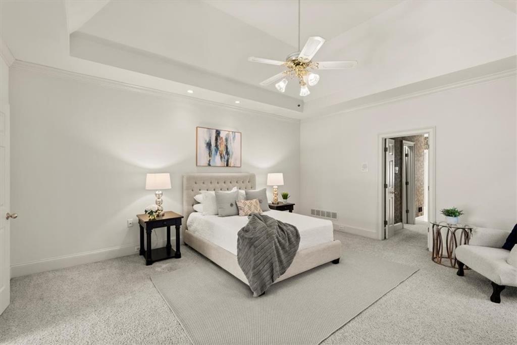 Experience the luxury of an oversized primary bedroom, offering an abundance of space for rest and relaxation. Experience the luxury of an oversized primary bedroom, offering an abundance of space for rest and relaxation.