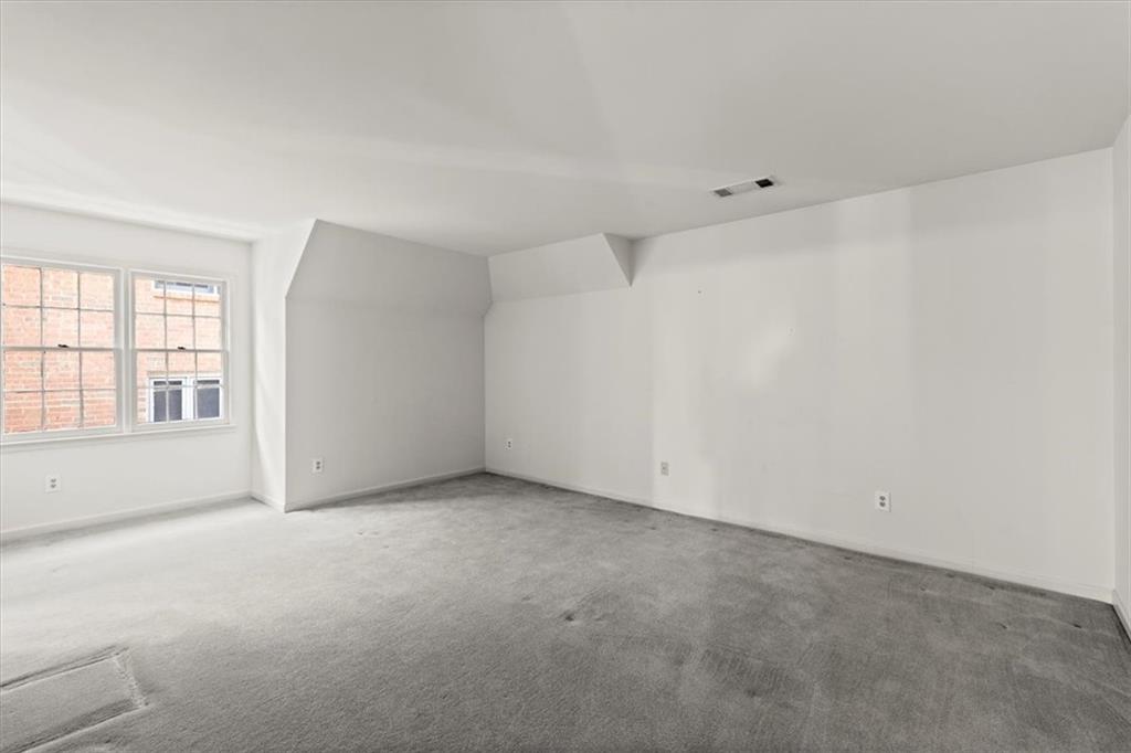 The third bedroom offers a generous amount of space, creating a comfortable and inviting space. The third bedroom offers a generous amount of space, creating a comfortable and inviting space.
