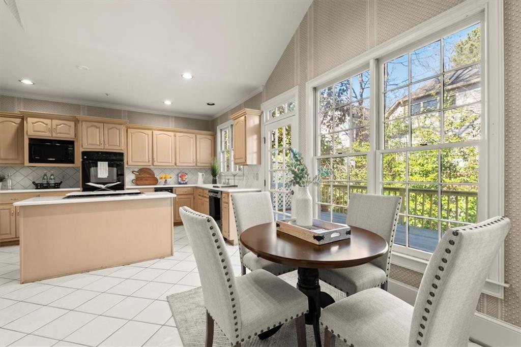 The kitchen's wall of windows floods the space in natural light. The seamless integration of the outdoors not only brightens the space but also allows for captivating views while preparing meals, creating a refreshing and inviting ambiance for culinary adventures. The kitchen's wall of windows floods the space in natural light. The seamless integration of the outdoors not only brightens the space but also allows for captivating views while preparing meals, creating a refreshing and inviting ambiance for culinary adventures.