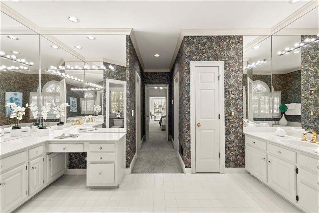 Experience the convenience of the spacious primary bathroom, designed with ample storage. From cabinets to drawers, this thoughtfully crafted space ensures everything has its place, keeping your essentials within easy reach. With his and hers vanities on separate sides of the bathroom, enjoy the luxury of personal space and organization. Experience the convenience of the spacious primary bathroom, designed with ample storage. From cabinets to drawers, this thoughtfully crafted space ensures everything has its place, keeping your essentials within easy reach. With his and hers vanities on separate sides of the bathroom, enjoy the luxury of personal space and organization.