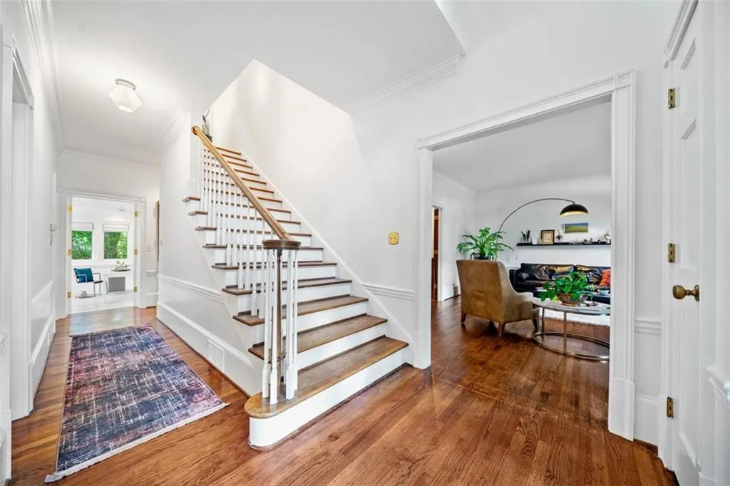 Stairs and view of formal living room