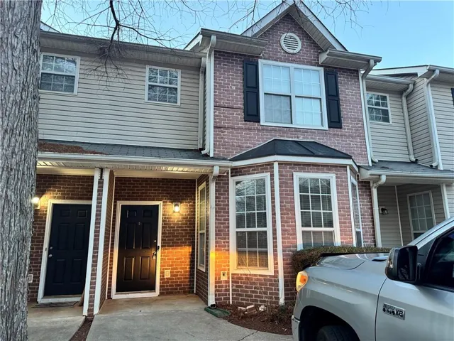 Brick and siding exterior with multiple windows