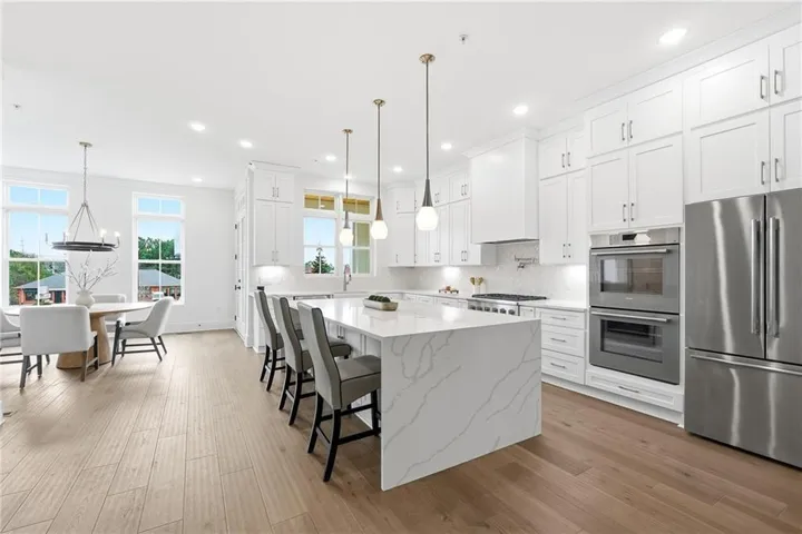 Gourmet chefs kitchen with oversized quartz island