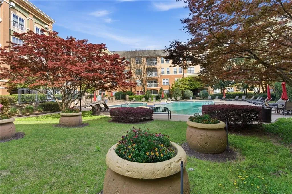 View of home's community featuring a patio area and a swimming pool