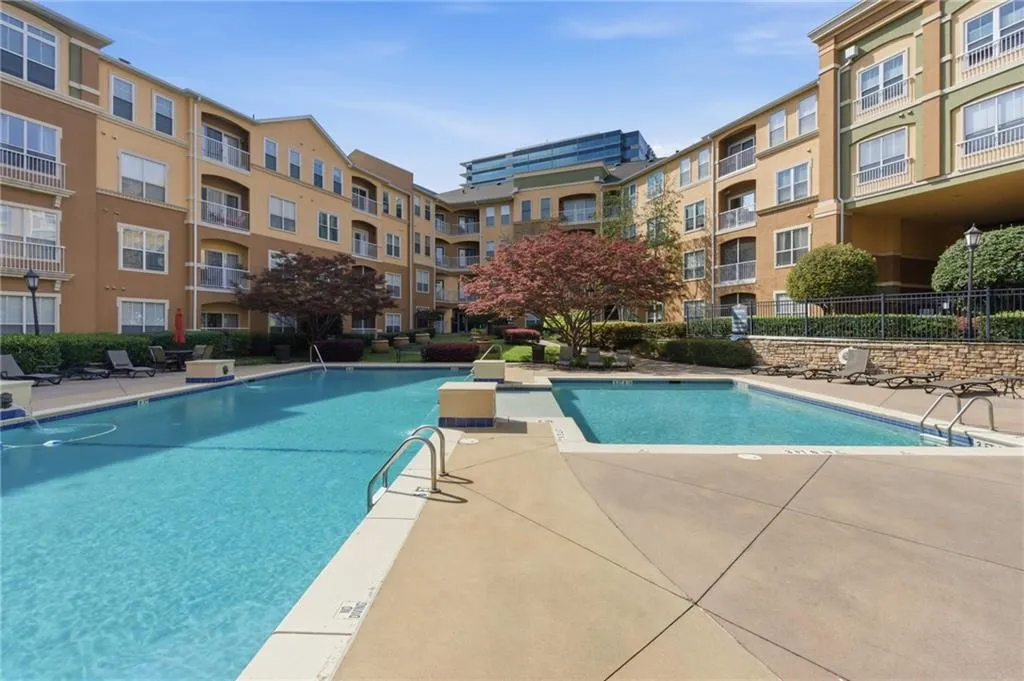 Community pool featuring a patio area