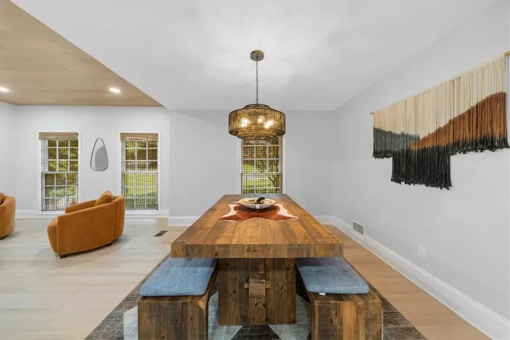 Dining area featuring recessed lighting, light wood-style flooring, and plenty of natural light