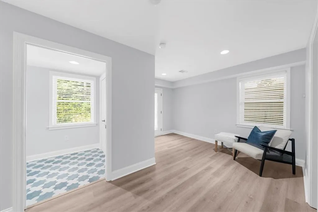 Sitting room featuring recessed lighting and light wood finished floors