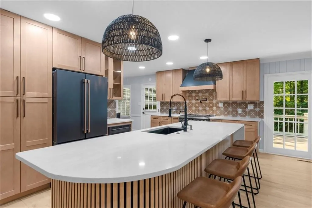 Kitchen featuring tasteful backsplash, light brown cabinets, high quality fridge, and recessed lighting