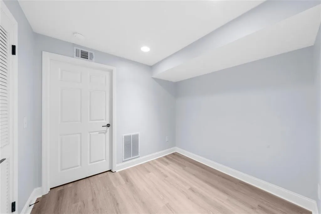 Unfurnished bedroom featuring light wood-type flooring and recessed lighting