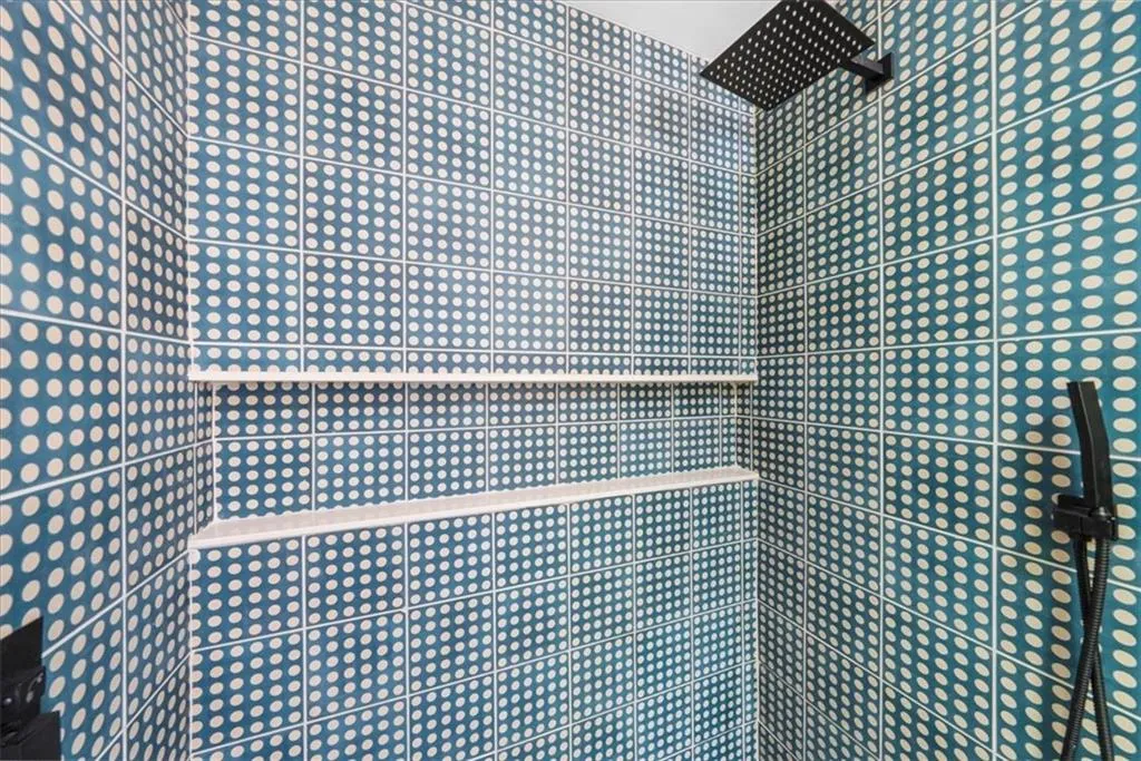 Full bathroom with tiled shower
