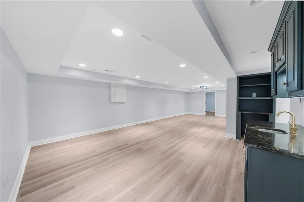 Unfurnished living room featuring light wood-style floors and recessed lighting