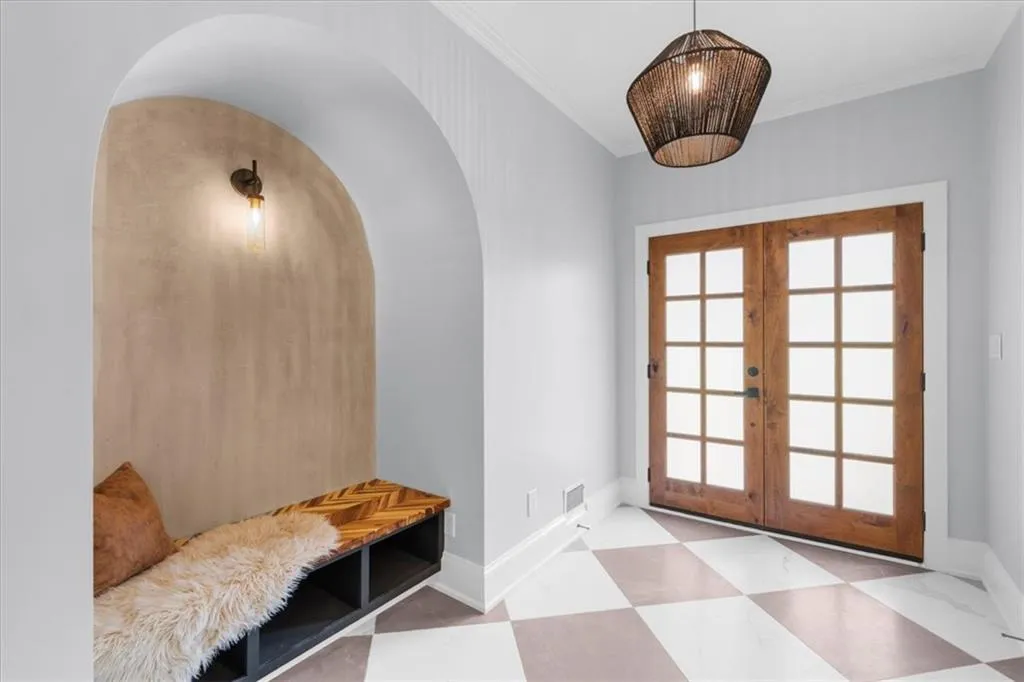 Mudroom with french doors and crown molding
