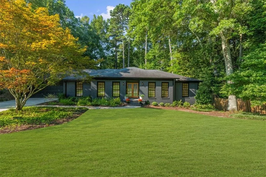 View of front of home featuring brick siding