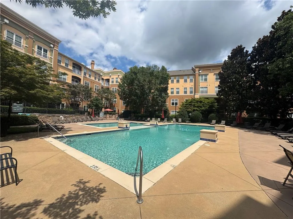 Community pool with a patio area