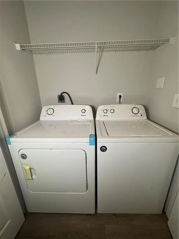 Laundry area with washing machine and clothes dryer