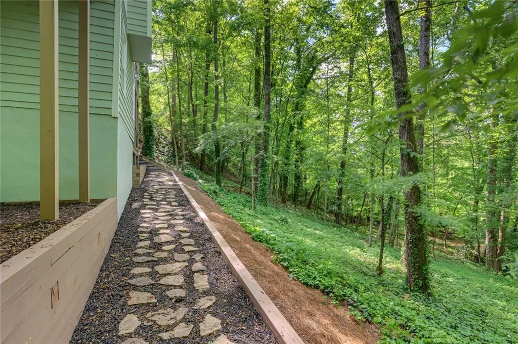 View of yard with a wooded view