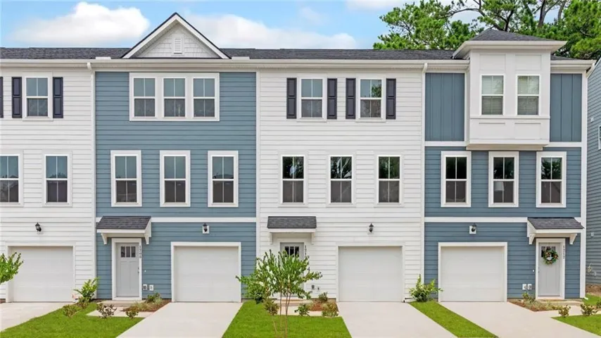 Townhome / multi-family property with a garage