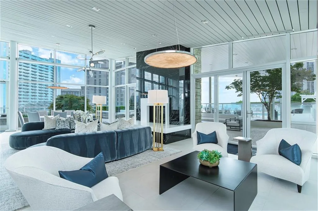 Lobby featuring expansive windows and wood ceiling