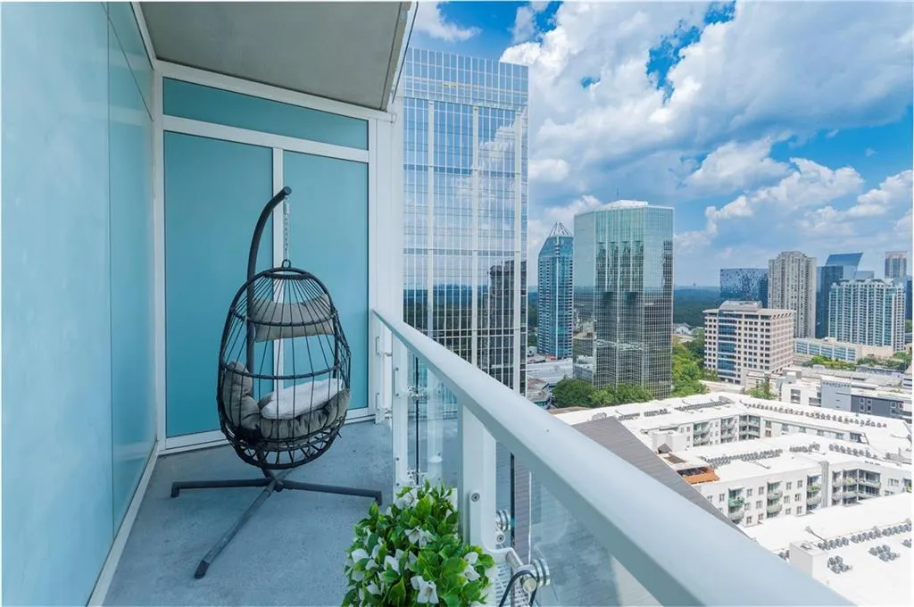 Balcony featuring a skyline view