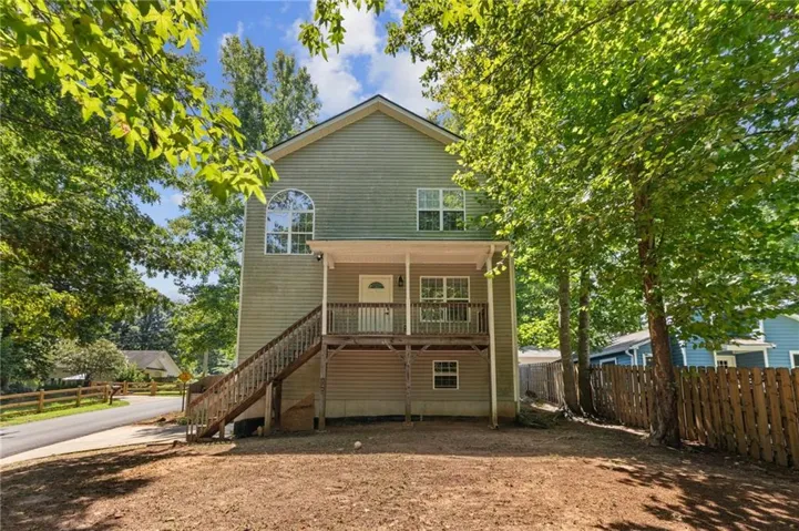 Two-story residence with horizontal siding and a gable roof