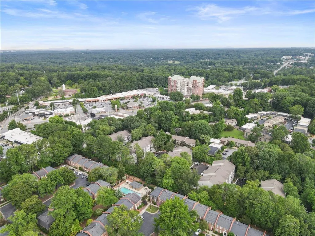 Aerial overview of property's location featuring nearby suburban area