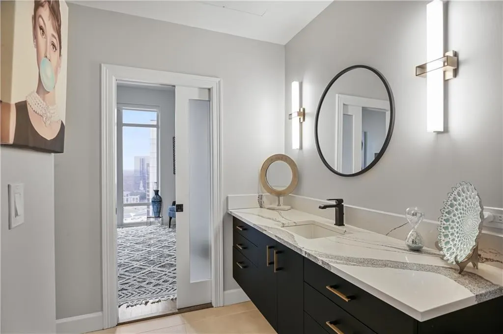 Bathroom featuring vanity and tile flooring