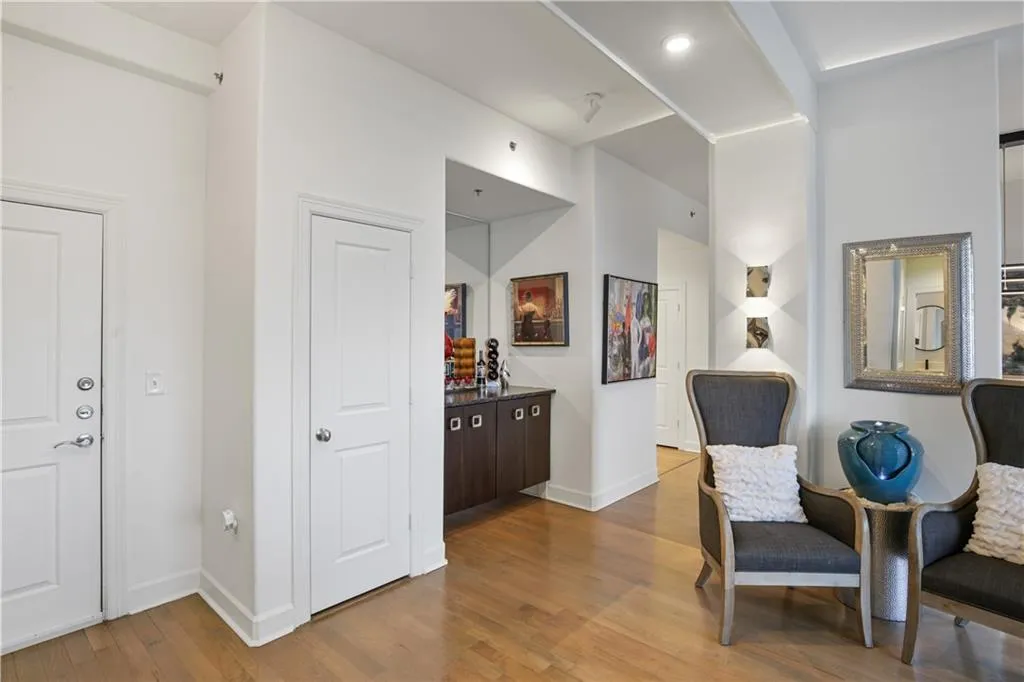 Sitting room with hardwood / wood-style floors