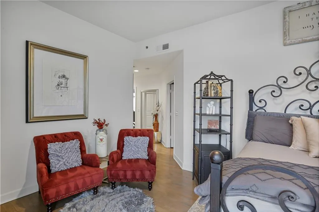 Bedroom with dark hardwood / wood-style floors