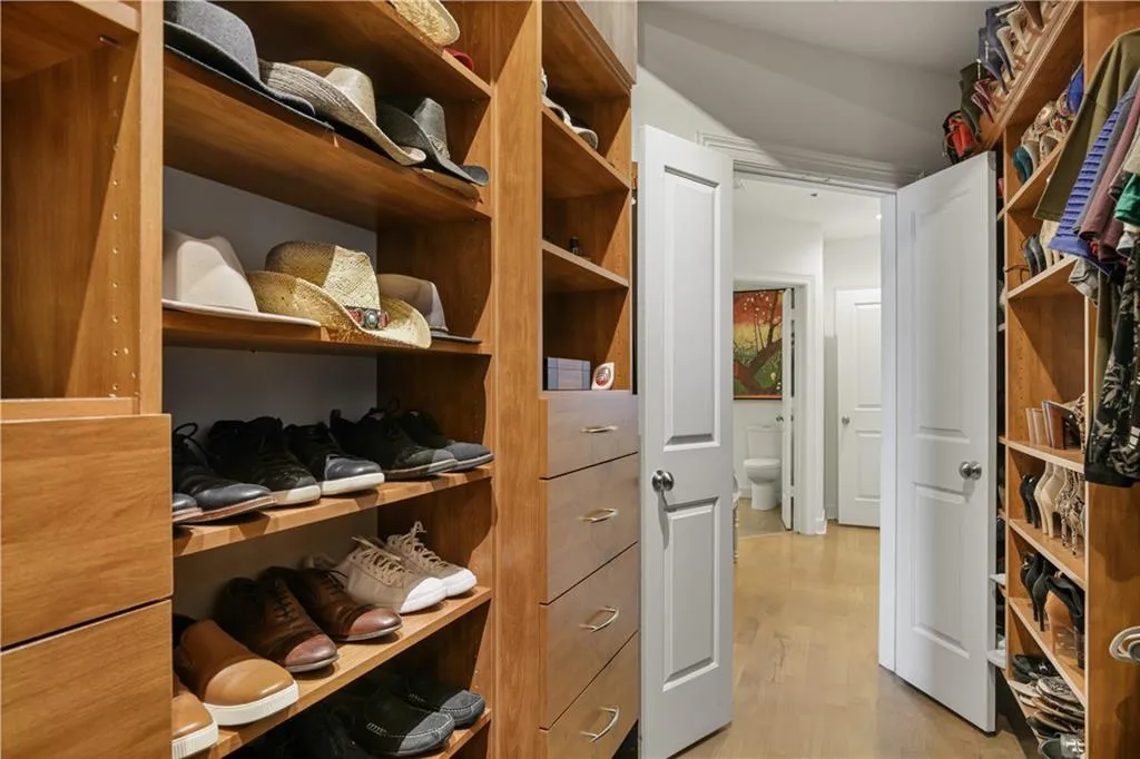 Walk in closet featuring light hardwood / wood-style floors
