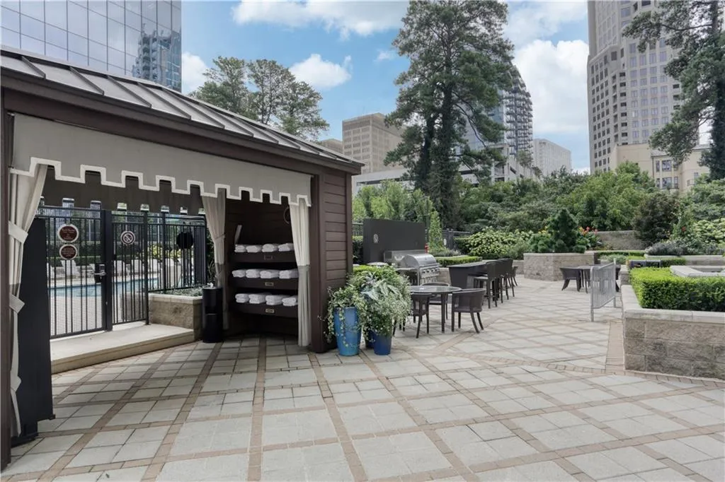 View of patio featuring area for grilling