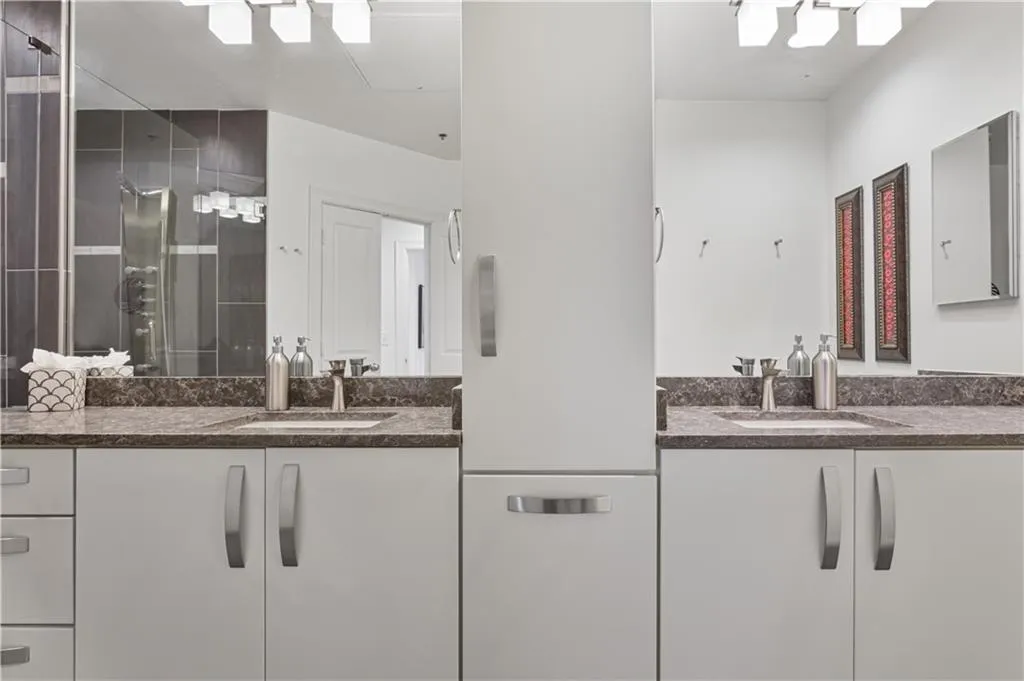 Bathroom with a shower with door and vanity