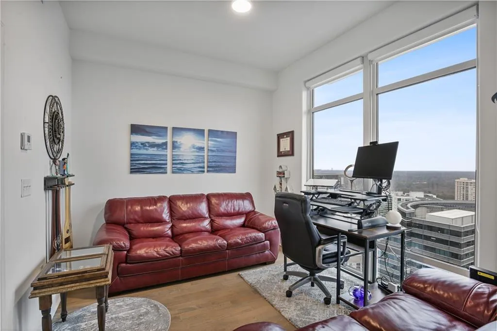 Office space with light hardwood / wood-style flooring