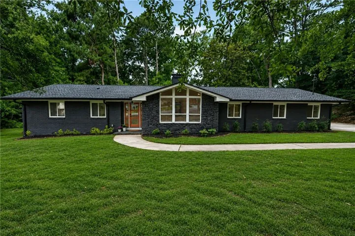 Ranch-style residence featuring a dark brick exterior