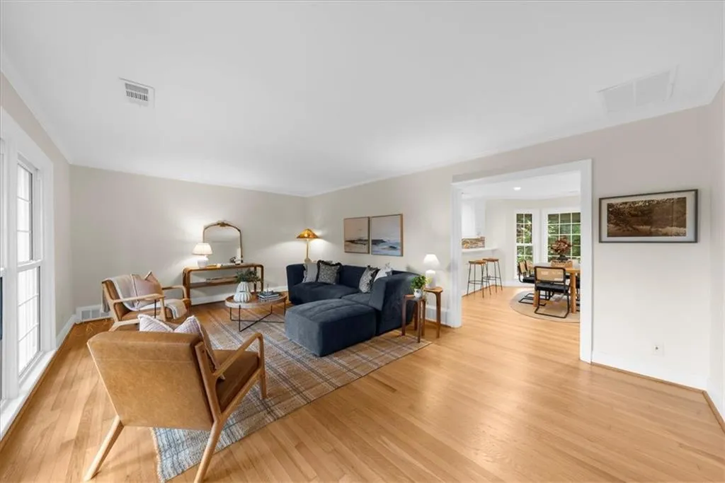 Living area featuring light wood-type flooring and baseboards