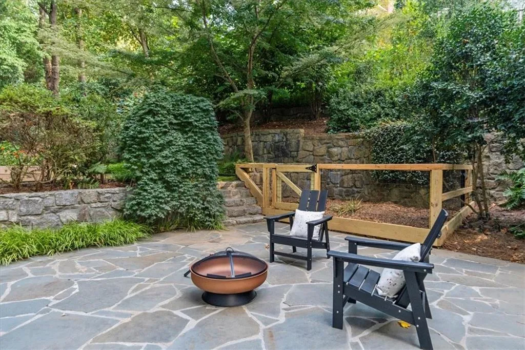 View of patio featuring an outdoor fire pit