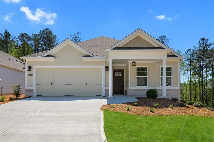 Craftsman style home with two car garage and water table brick front with full finished basement.